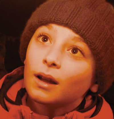 volto di un bambino pieno di stupore a Merry Flashmas di Creativi Digitali e Flash Mob Milano
